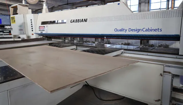 Panel saw on the Quality Design Cabinet production floor